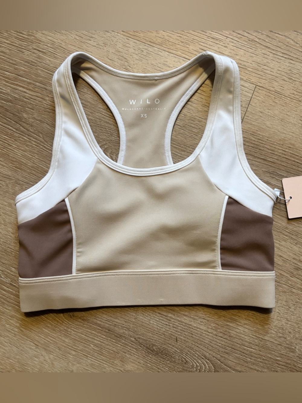 Willo Colorblock Racerback Sports Bra in Beige, Brown & White.